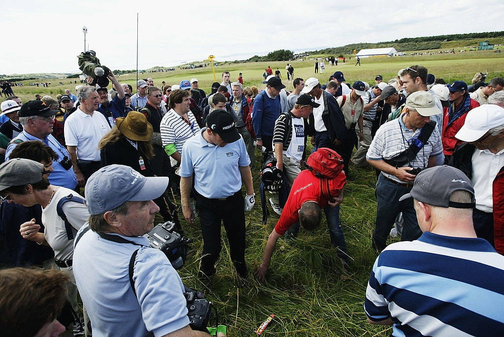Gary Evans searches for his ball at Muirfield's 17th hole in 2002